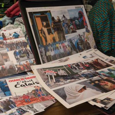 Mood boards in the YV Wardrobe department made up of images of refugees in camps in people in their native land.