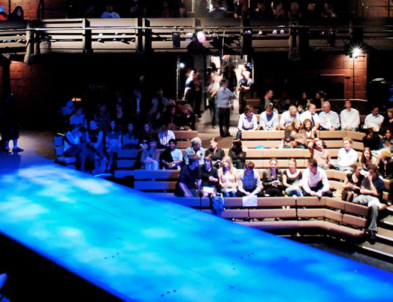 Interior of Young Vic auditorium with audience members before a performance